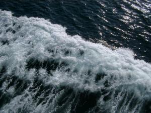 Water Waves Caused by Ferry Passing the Ocean